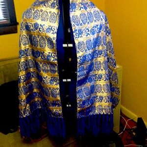 Shawl blue and gold. Polyester. 20 wide x 62 long. Fringe 6 inches yarn.